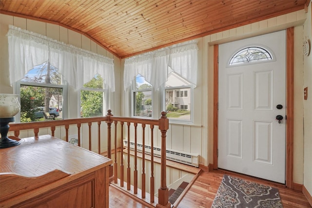 34 Argyle St, Lake Peekskill, NY 10537 - foyer with a baseboard heating unit, vaulted ceiling, wooden ceiling, and wood finished floors