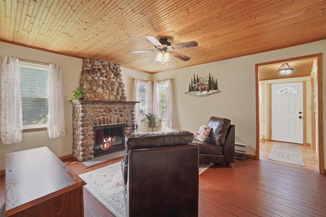 34 Argyle St, Lake Peekskill, NY 10537 - living room featuring a ceiling fan, ornamental molding, a stone fireplace, hardwood / wood-style flooring, and wooden ceiling
