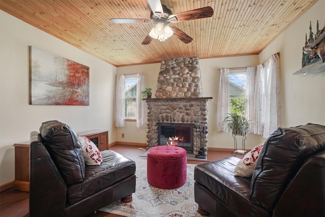 34 Argyle St, Lake Peekskill, NY 10537 - living area featuring wood finished floors, a ceiling fan, a stone fireplace, ornamental molding, and baseboards