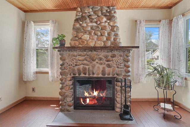 34 Argyle St, Lake Peekskill, NY 10537 - detailed view of wooden ceiling, a stone fireplace, wood finished floors, crown molding, and baseboards