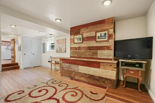 34 Argyle St, Lake Peekskill, NY 10537 - living area featuring wood finished floors, baseboards, and wooden walls