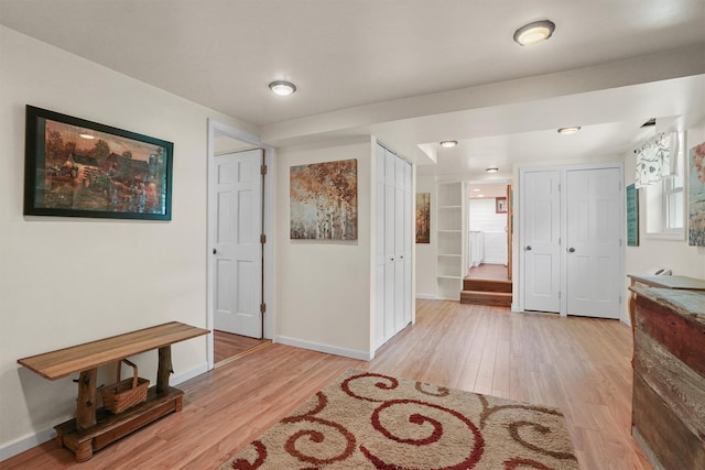 34 Argyle St, Lake Peekskill, NY 10537 - hall with light wood-style flooring and baseboards