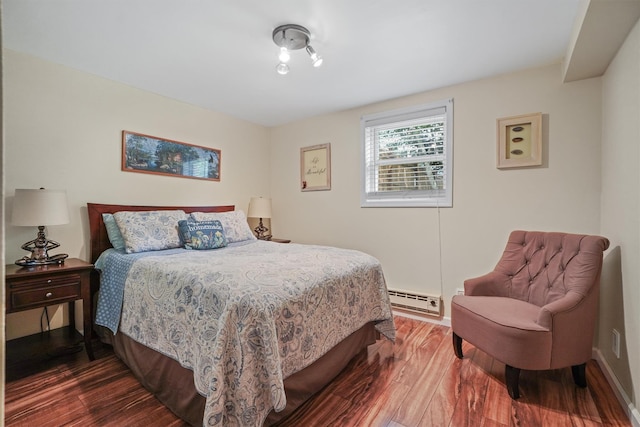 34 Argyle St, Lake Peekskill, NY 10537 - bedroom featuring dark wood-style flooring, baseboard heating, and baseboards