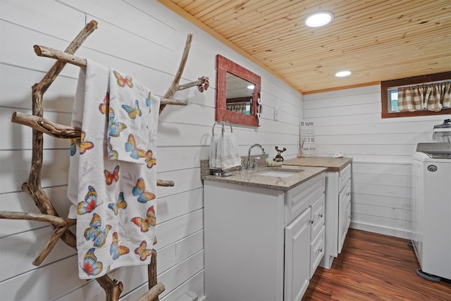34 Argyle St, Lake Peekskill, NY 10537 - bathroom featuring washer / dryer, wood ceiling, vanity, wooden walls, and wood finished floors