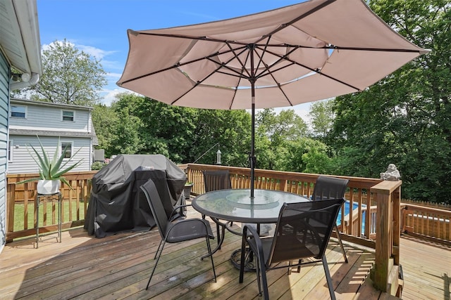 34 Argyle St, Lake Peekskill, NY 10537 - wooden terrace with outdoor dining space and view of wooded area