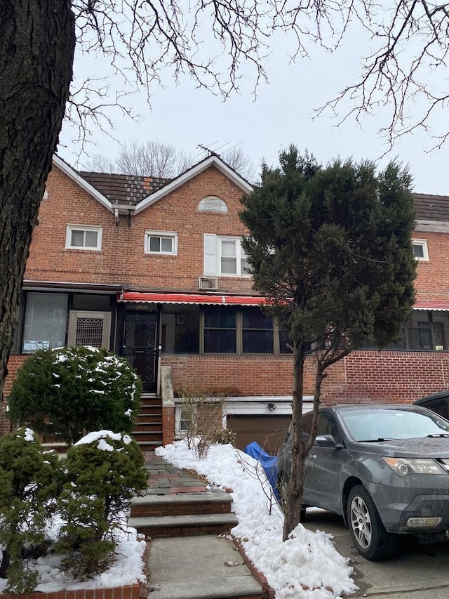 6111 Alderton St, Rego Park, NY 11374 - view of front of home featuring brick siding and a garage