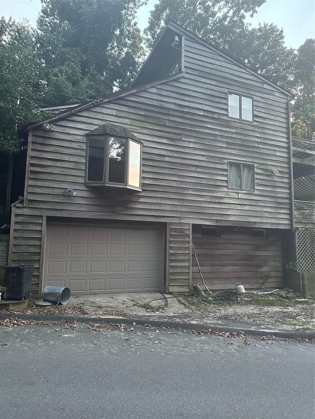90 Landing Rd, Miller Place, NY 11764 - view of side of home featuring an attached garage
