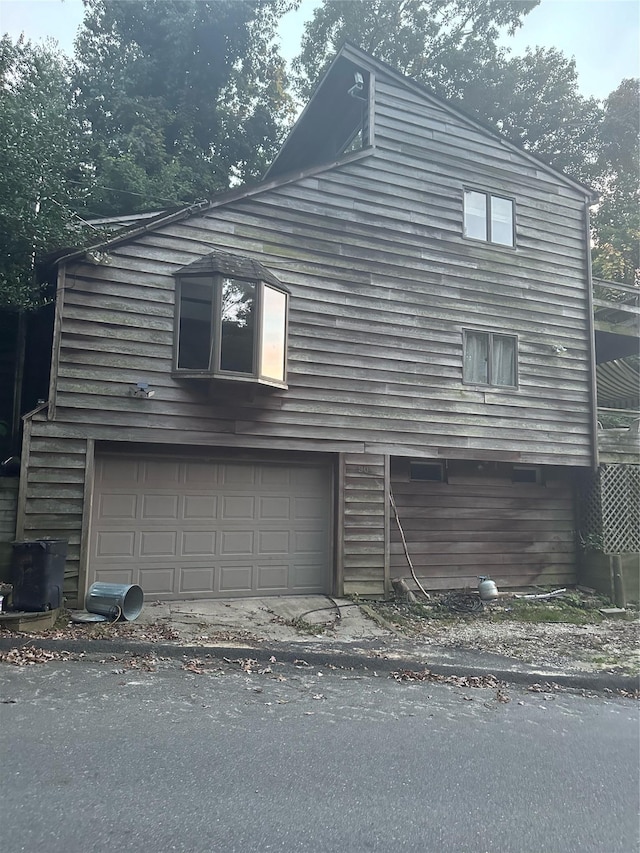 90 Landing Rd, Miller Place, NY 11764 - view of side of home featuring an attached garage