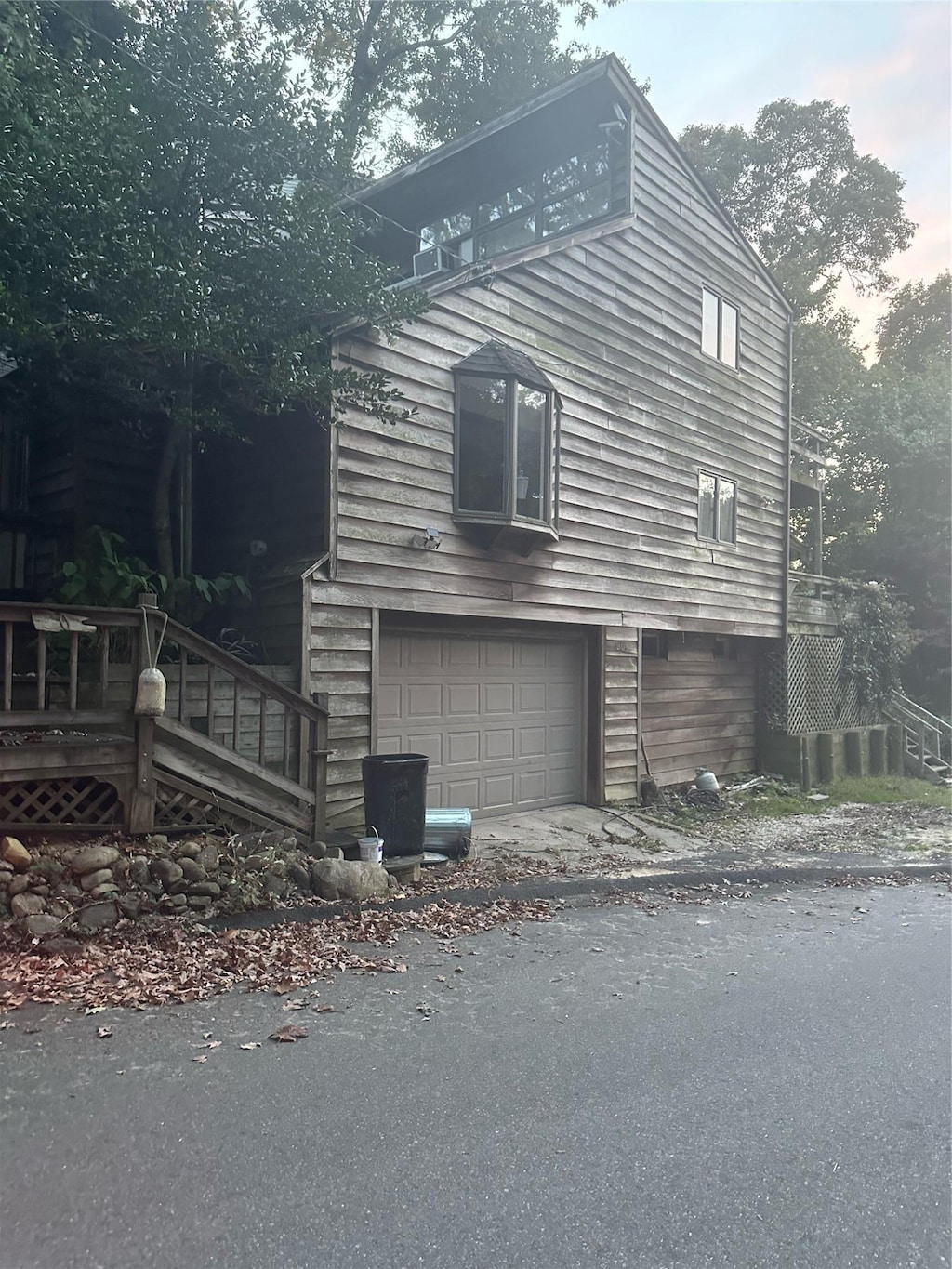 90 Landing Rd, Miller Place, NY 11764 - view of side of home with a garage