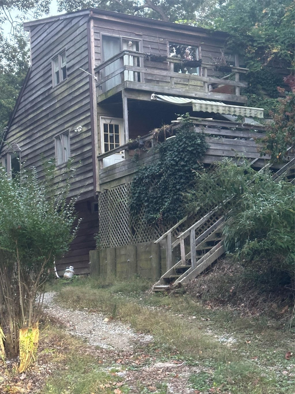 90 Landing Rd, Miller Place, NY 11764 - rear view of property featuring a balcony and stairs