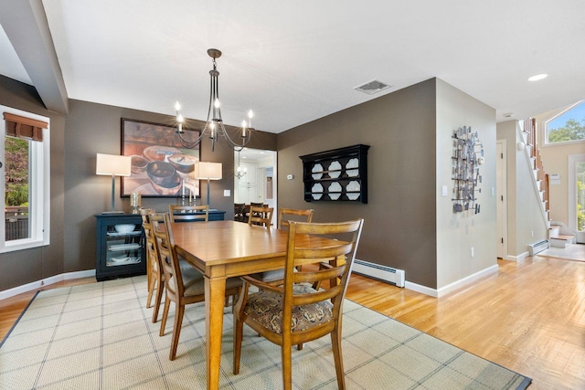 226 Briarwood Dr, Somers, NY 10589 - dining area with a baseboard radiator, light wood-style floors, stairway, a chandelier, and recessed lighting