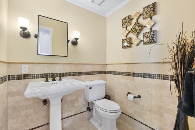 226 Briarwood Dr, Somers, NY 10589 - half bathroom with tile walls, crown molding, a wainscoted wall, and tile patterned floors
