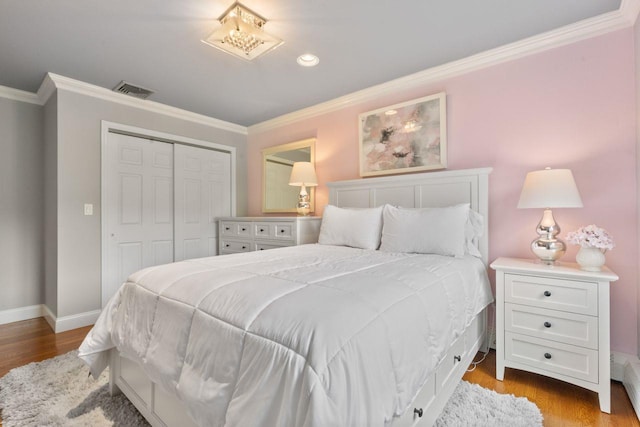 226 Briarwood Dr, Somers, NY 10589 - bedroom with ornamental molding, a closet, wood finished floors, and recessed lighting