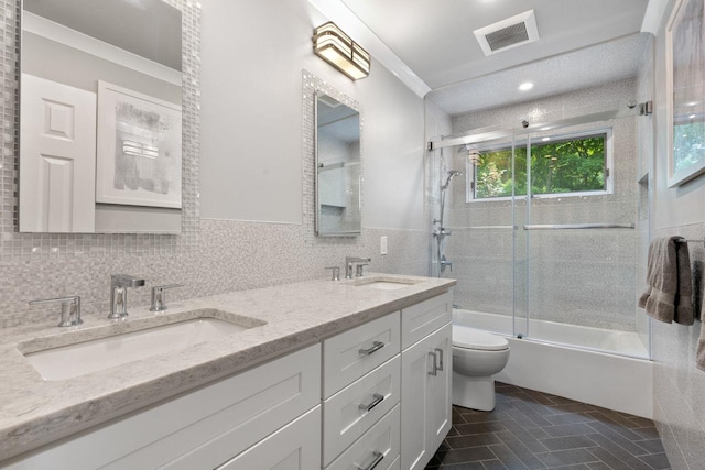 226 Briarwood Dr, Somers, NY 10589 - bathroom with bath / shower combo with glass door, double vanity, tile walls, and tile patterned flooring