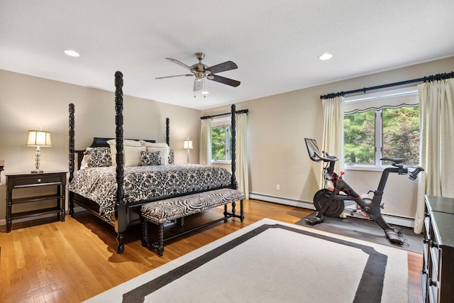 226 Briarwood Dr, Somers, NY 10589 - bedroom featuring light wood-type flooring, recessed lighting, a baseboard heating unit, and ceiling fan