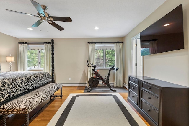 226 Briarwood Dr, Somers, NY 10589 - bedroom featuring light wood-type flooring, recessed lighting, ceiling fan, and a baseboard heating unit
