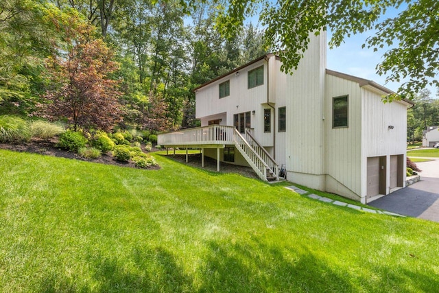 226 Briarwood Dr, Somers, NY 10589 - rear view of house featuring stairs, a deck, a lawn, driveway, and an attached garage