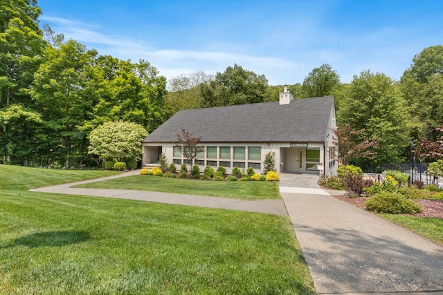 226 Briarwood Dr, Somers, NY 10589 - view of front of home with a chimney and roof with shingles
