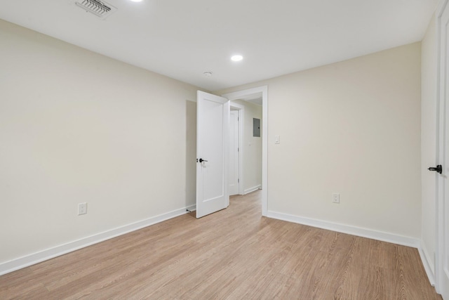 1293 Pulaski Rd, East Northport, NY 11731 - unfurnished room featuring light wood finished floors, baseboards, recessed lighting, and electric panel