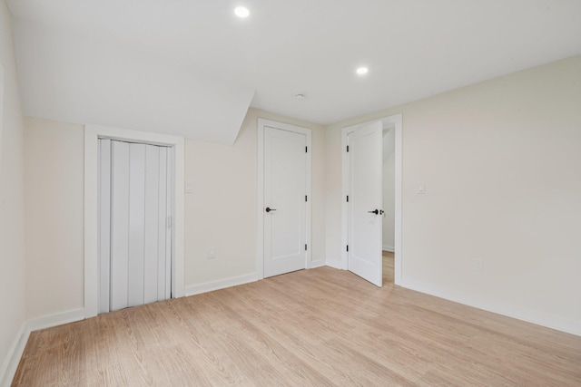 1293 Pulaski Rd, East Northport, NY 11731 - unfurnished bedroom with light wood-style floors, recessed lighting, and baseboards