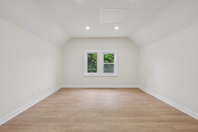 1293 Pulaski Rd, East Northport, NY 11731 - bonus room featuring light wood-style flooring, lofted ceiling, baseboards, and recessed lighting