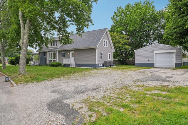1293 Pulaski Rd, East Northport, NY 11731 - view of front of property with a detached garage, an outdoor structure, central AC, and roof with shingles