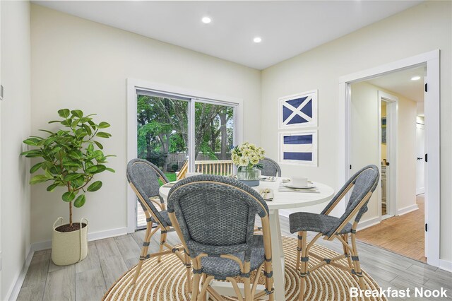 1293 Pulaski Rd, East Northport, NY 11731 - dining space featuring light wood-style flooring and recessed lighting