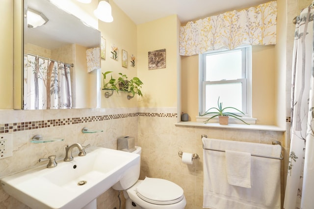 131-2 S Highland Ave Unit A3, Ossining, NY 10562 - full bathroom with a sink, toilet, tile walls, curtained shower, and a wainscoted wall