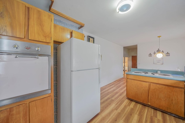 3 Shelter Hill Rd, Plainview, NY 11803 - kitchen with white appliances, light wood finished floors, brown cabinets, and pendant lighting