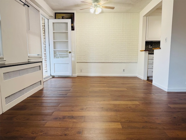 43-10 Kissena Blvd Unit 2B, Flushing, NY 11355 - unfurnished living room featuring ceiling fan, wood finished floors, radiator, and baseboards