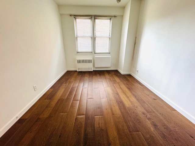 43-10 Kissena Blvd Unit 2B, Flushing, NY 11355 - spare room with radiator, wood finished floors, and baseboards