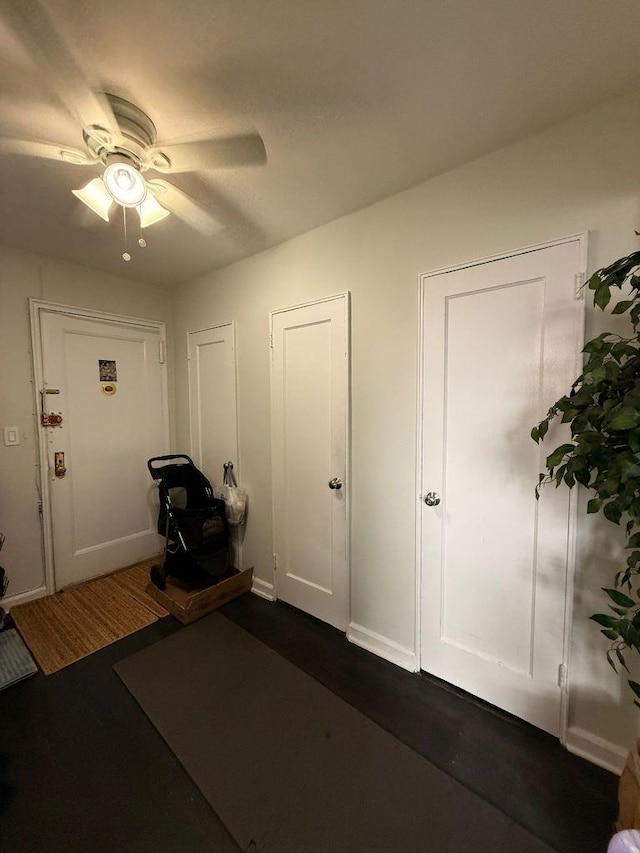 105-37 65th Ave Unit 6E, Forest Hills, NY 11375 - exercise area with a ceiling fan, dark wood finished floors, and baseboards