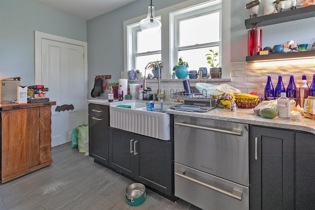 184 Highland Ave, Middletown, NY 10940 - kitchen featuring a sink, dishwasher, backsplash, light stone countertops, and wood finished floors