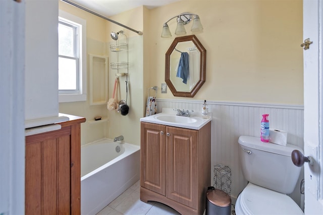 184 Highland Ave, Middletown, NY 10940 - full bathroom with vanity, toilet, tub / shower combination, tile patterned flooring, and a wainscoted wall