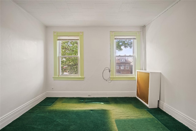 4614 Carpenter Ave, Bronx, NY 10470 - spare room with dark colored carpet, plenty of natural light, and baseboards