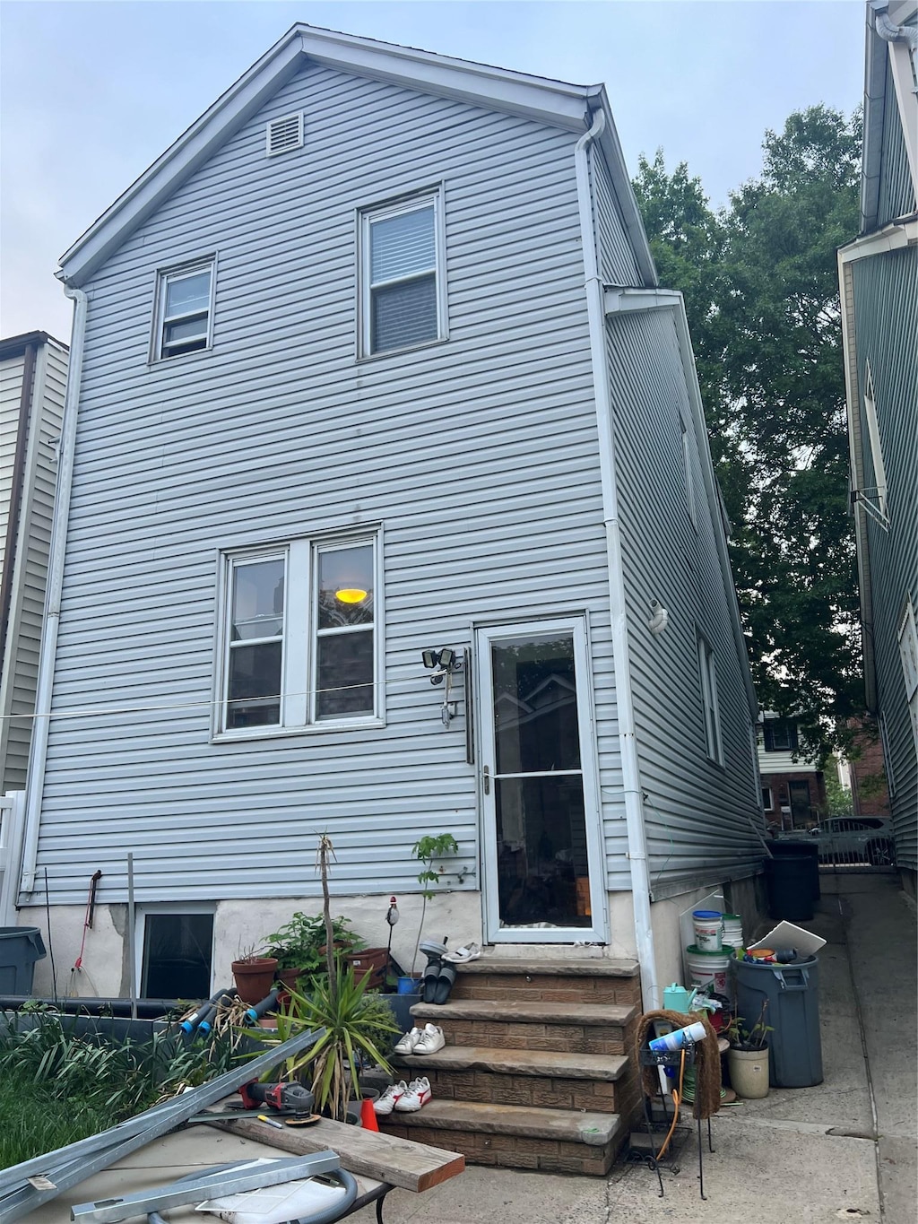 22-26 74th St, East Elmhurst, NY 11370 - rear view of property featuring entry steps