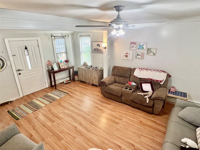 22-26 74th St, East Elmhurst, NY 11370 - living room featuring wood finished floors, ceiling fan, and baseboard heating