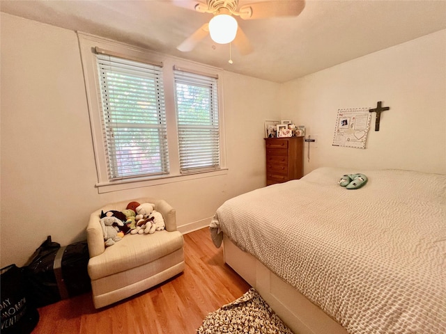 22-26 74th St, East Elmhurst, NY 11370 - bedroom featuring wood finished floors and a ceiling fan