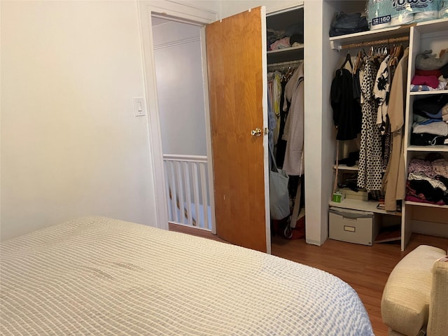22-26 74th St, East Elmhurst, NY 11370 - bedroom with wood finished floors and a closet