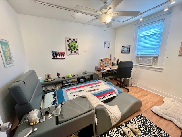 22-26 74th St, East Elmhurst, NY 11370 - office area featuring ceiling fan, rail lighting, wood finished floors, and cooling unit