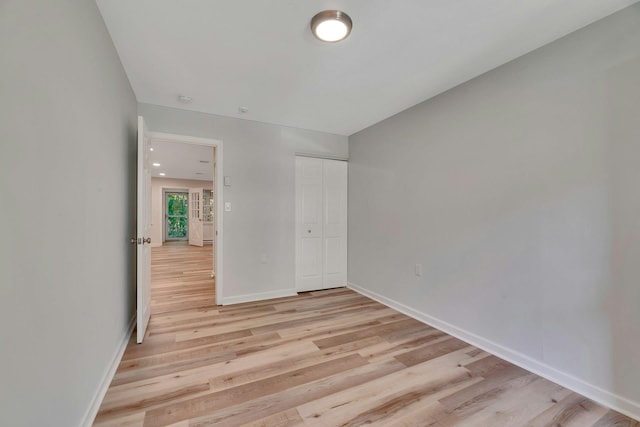 305C Torquay Court, Ridge, NY 11961 - unfurnished bedroom featuring light wood-type flooring and a closet