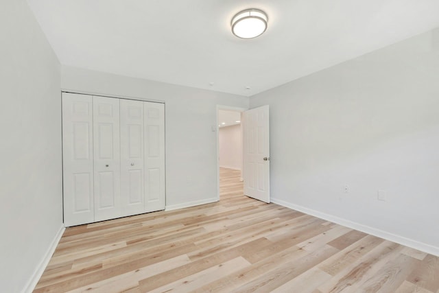 305C Torquay Court, Ridge, NY 11961 - unfurnished bedroom featuring light wood-type flooring and a closet