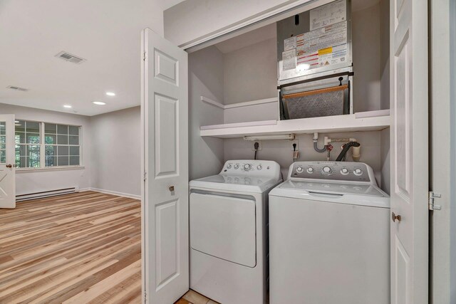 305C Torquay Court, Ridge, NY 11961 - laundry area featuring a baseboard heating unit, light wood-style flooring, independent washer and dryer, and recessed lighting