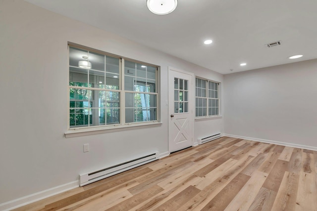 305C Torquay Court, Ridge, NY 11961 - unfurnished room with a baseboard radiator, wood finished floors, and recessed lighting