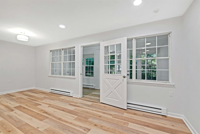 305C Torquay Court, Ridge, NY 11961 - empty room with baseboard heating, wood finished floors, and recessed lighting