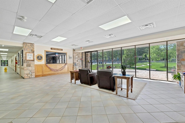 305C Torquay Court, Ridge, NY 11961 - building lobby with a paneled ceiling and a wainscoted wall