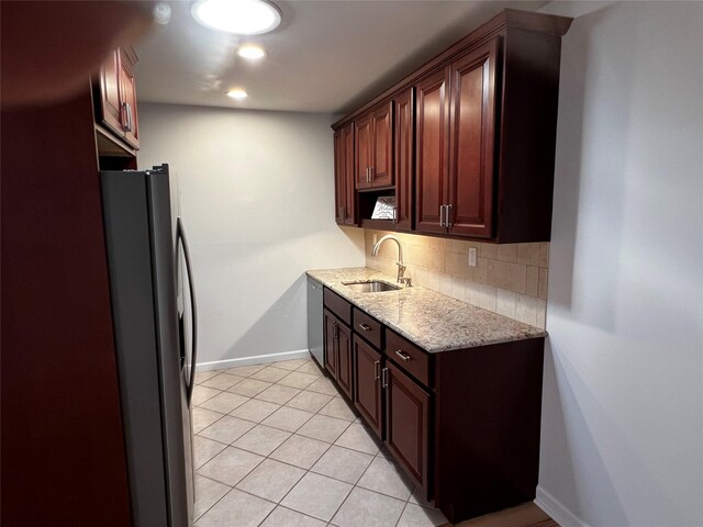 305C Torquay Court, Ridge, NY 11961 - kitchen featuring stainless steel fridge, tasteful backsplash, light stone countertops, and light tile patterned floors