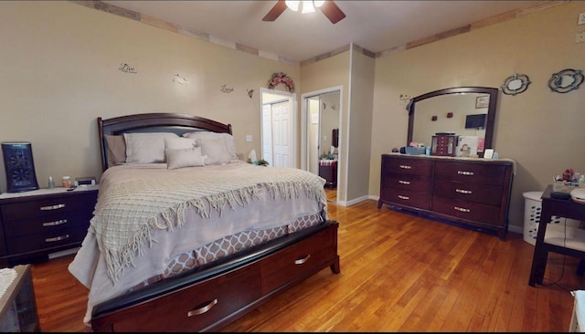 2547 Laconia Ave, Bronx, NY 10469 - bedroom featuring wood finished floors, a ceiling fan, ensuite bath, and baseboards