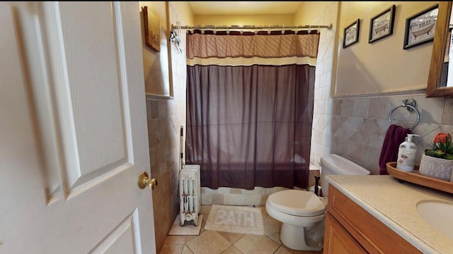 2547 Laconia Ave, Bronx, NY 10469 - full bathroom featuring tile walls, radiator heating unit, toilet, tile patterned floors, and vanity