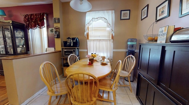 2547 Laconia Ave, Bronx, NY 10469 - dining space with light tile patterned floors and baseboards